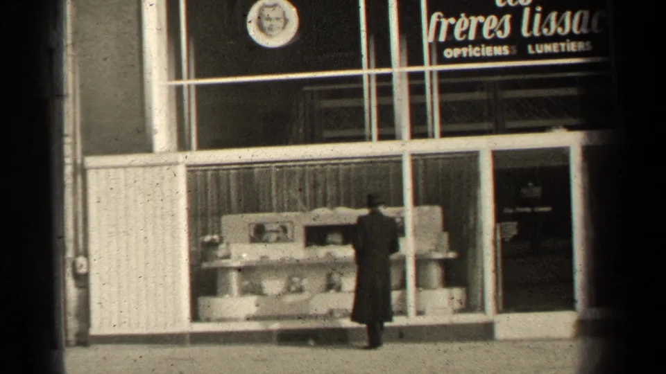 The final frame shows the man near the right display area of the Paris optician storefront, with signage and facade details visible.