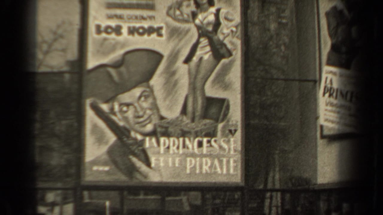 1947 Paris frame showing a large poster for Bob Hope's La Princesse et le Pirate beside a boulevard view.