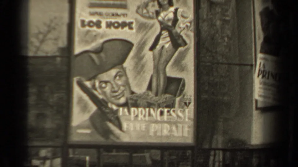 Close 1947 Paris 8mm view of a French La Princesse et le Pirate poster with Bob Hope artwork and adjacent poster edge.