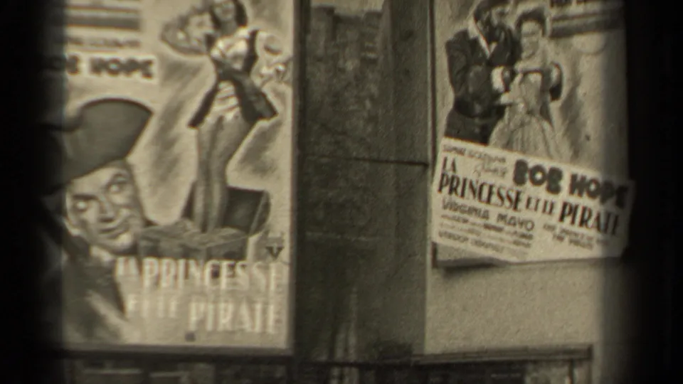 1947 Paris 8mm frame with Bob Hope La Princesse et le Pirate posters and another French poster panel in view.