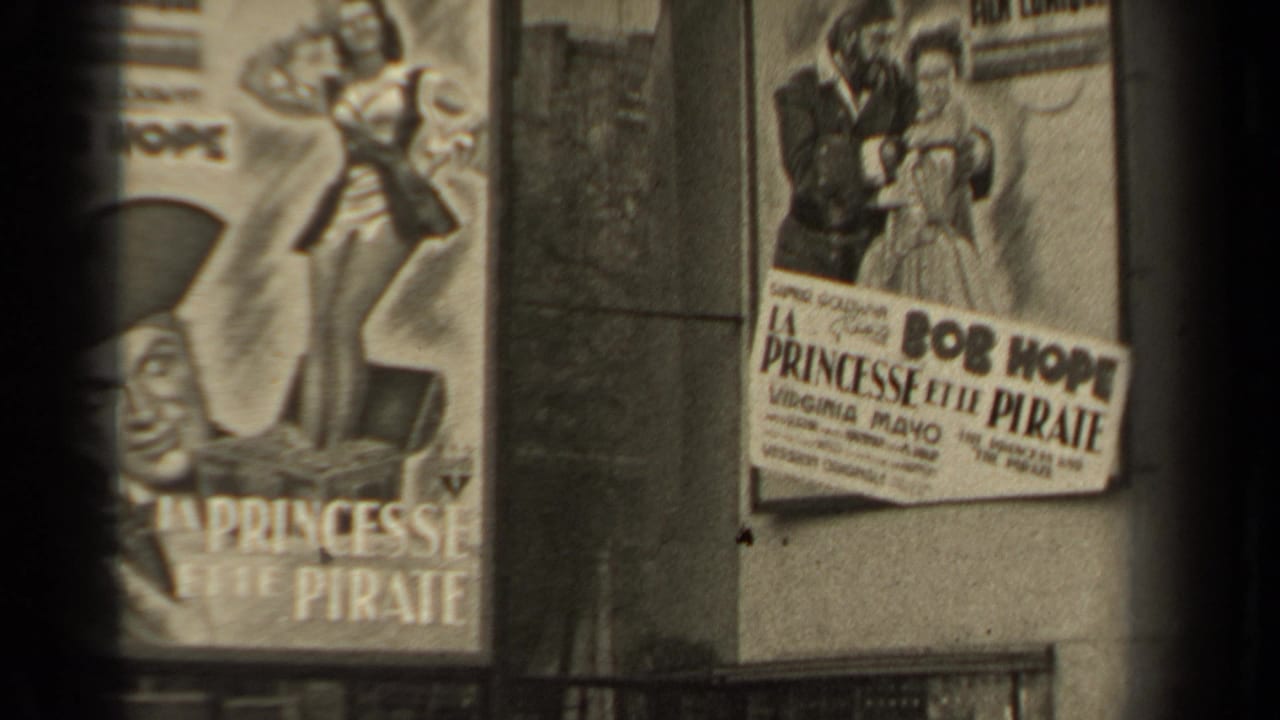 1947 Paris footage showing La Princesse et le Pirate posters on a weathered wall, with Bob Hope text and illustrated figures partly visible.