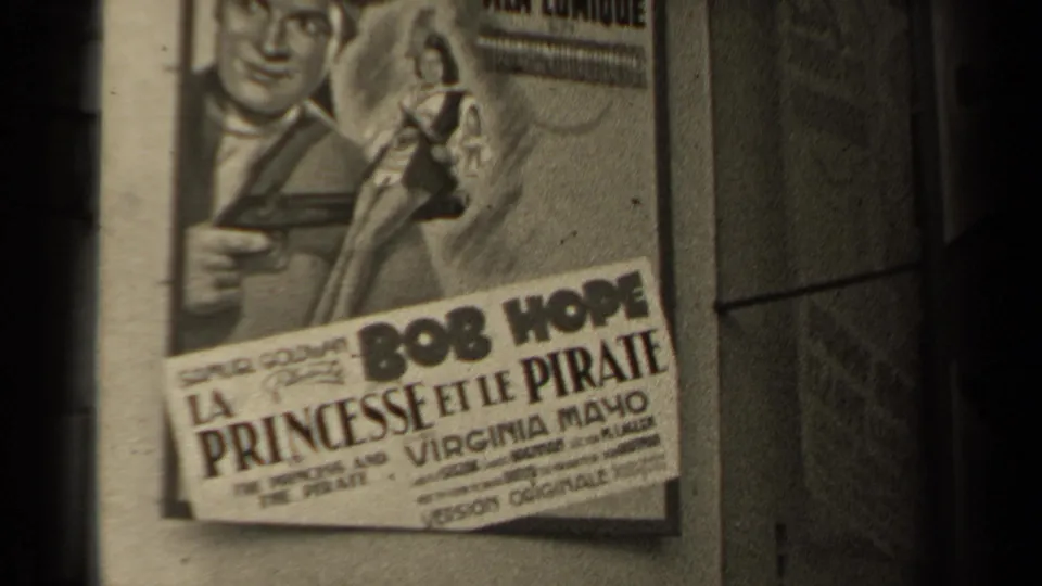 1947 Paris 8mm frame showing a French poster for La Princesse et le Pirate with Bob Hope and Virginia Mayo names visible.