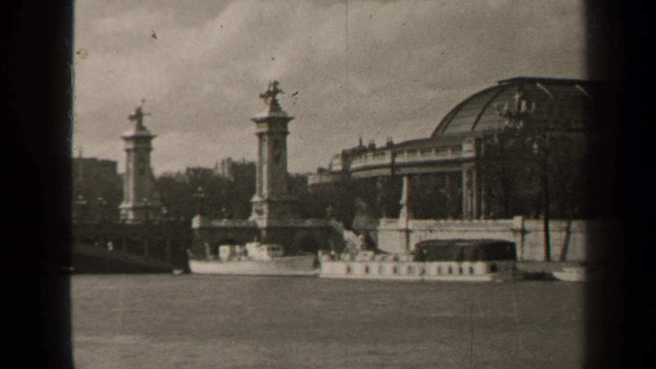 1947 Paris frame with Pont Alexandre III ornamented pylons, a domed riverside building, and a riverboat on the Seine.