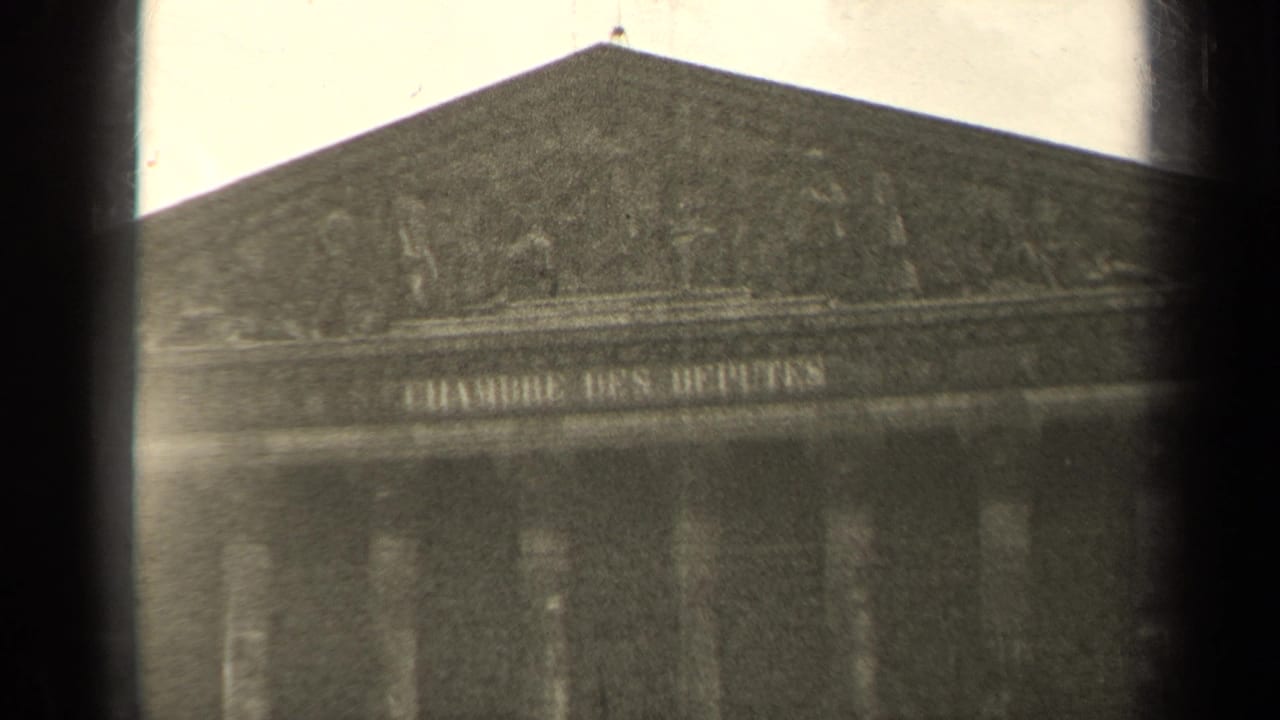 A soft black-and-white 1947 Paris 8mm view holds on the Chambre des Députés facade and inscription.