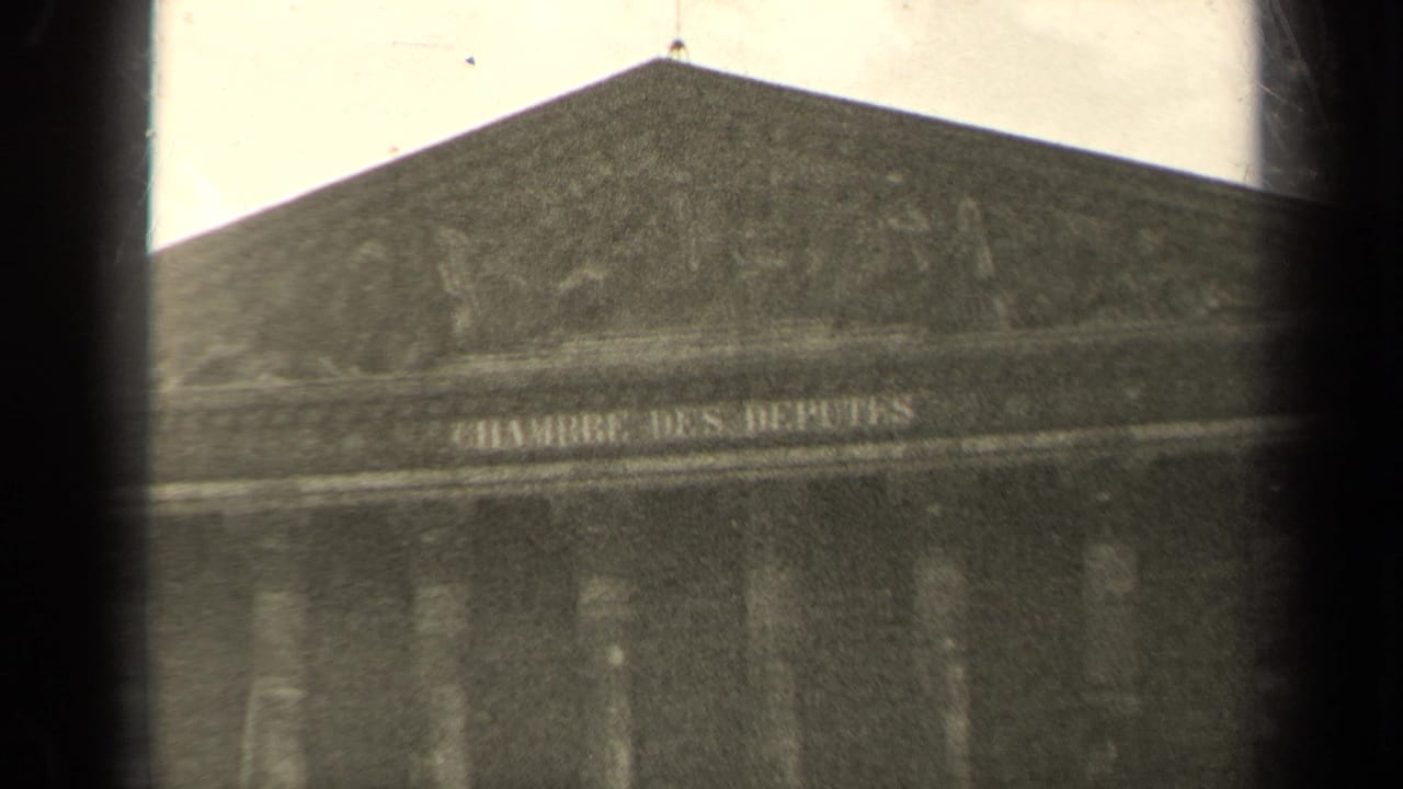 1947 Paris 8mm frame showing the Chambre des Députés inscription beneath the pediment, with dark edge vignetting.