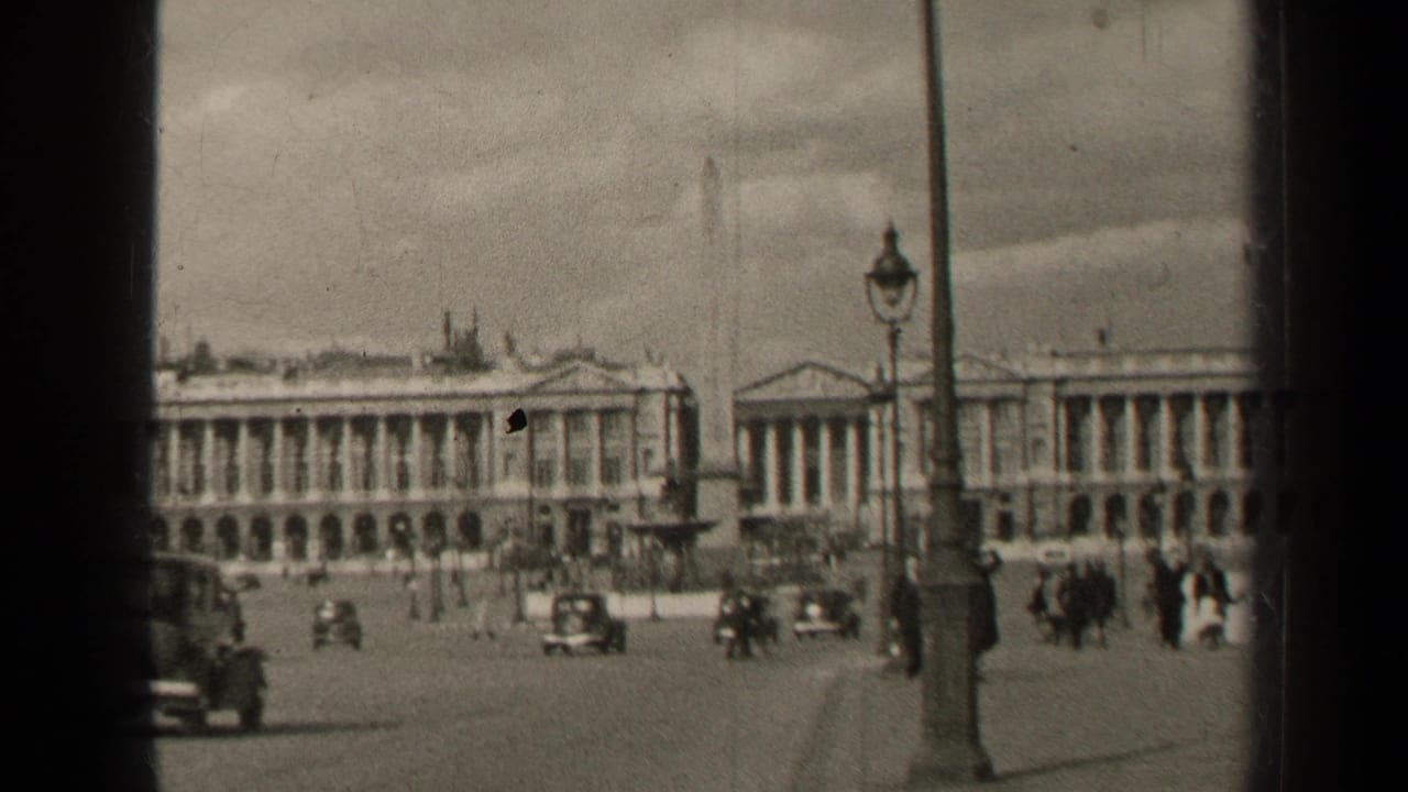 1947 Paris public square viewed through a window frame, with pedestrians and classic cars moving near an obelisk and neoclassical buildings.