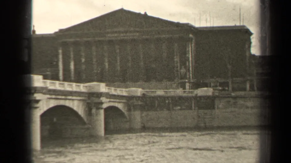 A similar 1947 Paris river view shows bridge arches, a stone embankment, and a large building behind the roadway.