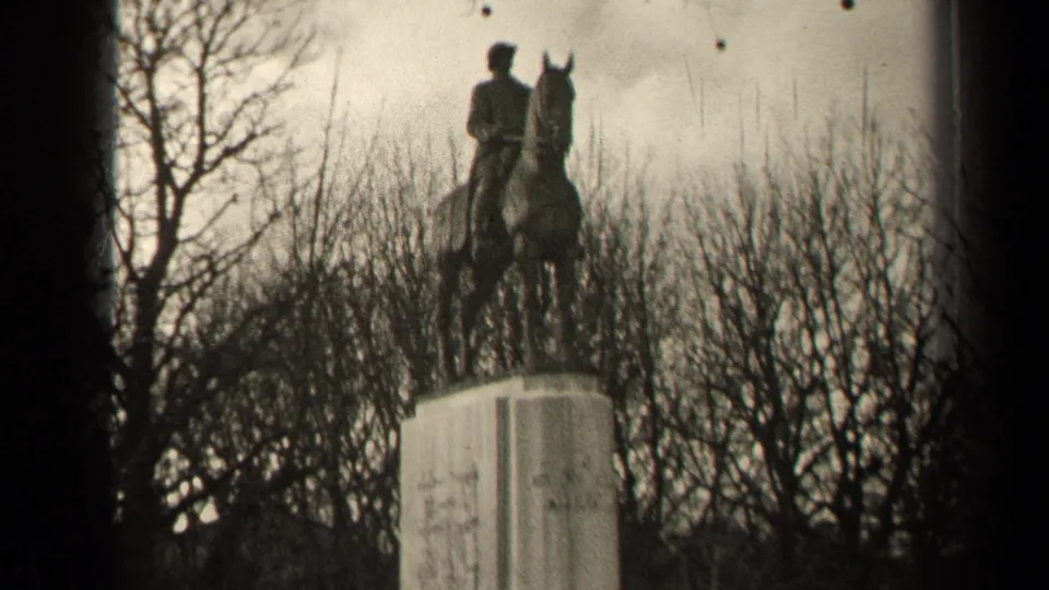 1947 visitor-shot frame of a Paris equestrian statue, with the horse and rider clearer above the pedestal.