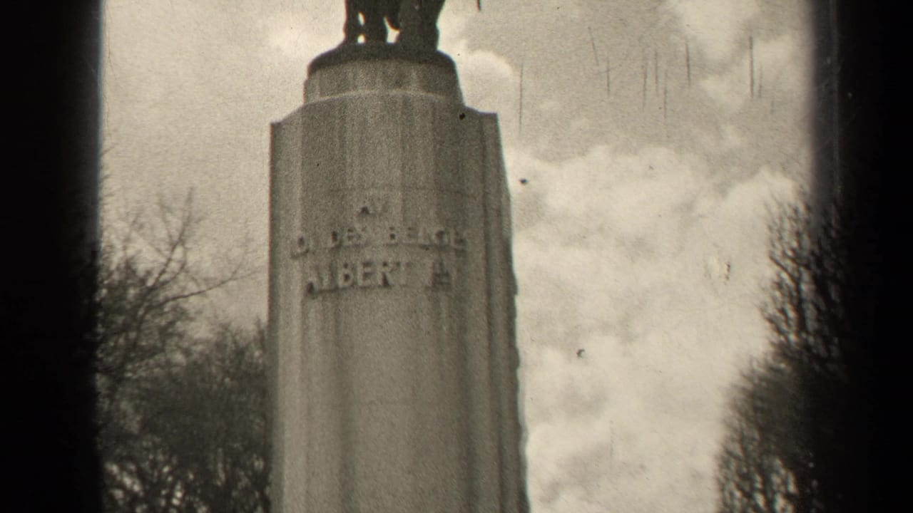 Black-and-white Paris frame showing the upper pedestal of an equestrian monument with partial raised inscription visible.
