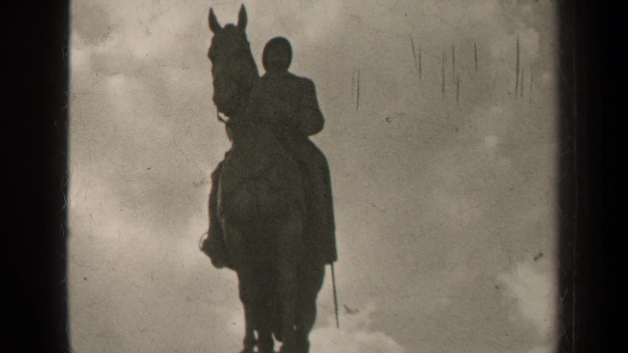 1947 Paris 8mm frame showing a dark equestrian statue silhouette with the rider and horse set against a cloudy sky.