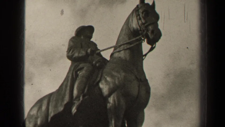 Closer 1947 Paris 8mm view of the equestrian statue, emphasizing the rider, reins, horse head, and cloudy sky.
