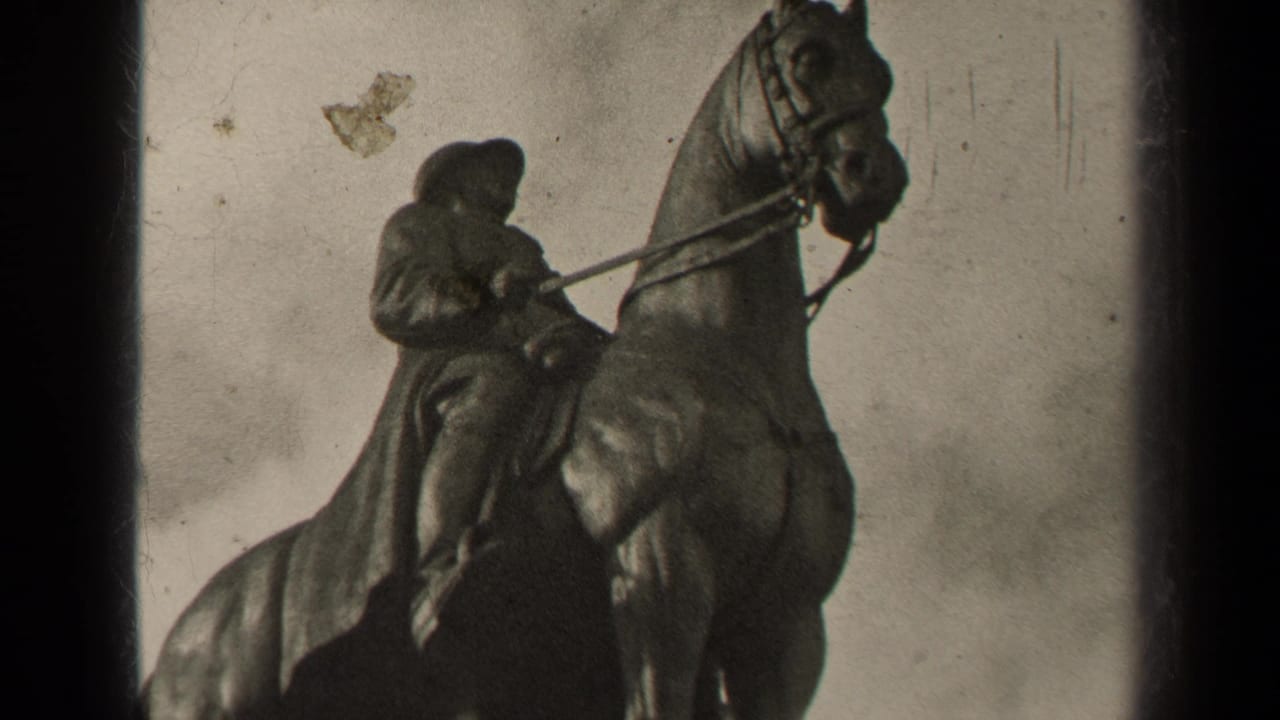 1947 Paris home-movie frame of the equestrian statue, with the rider bent forward and the horse cropped near the top edge.