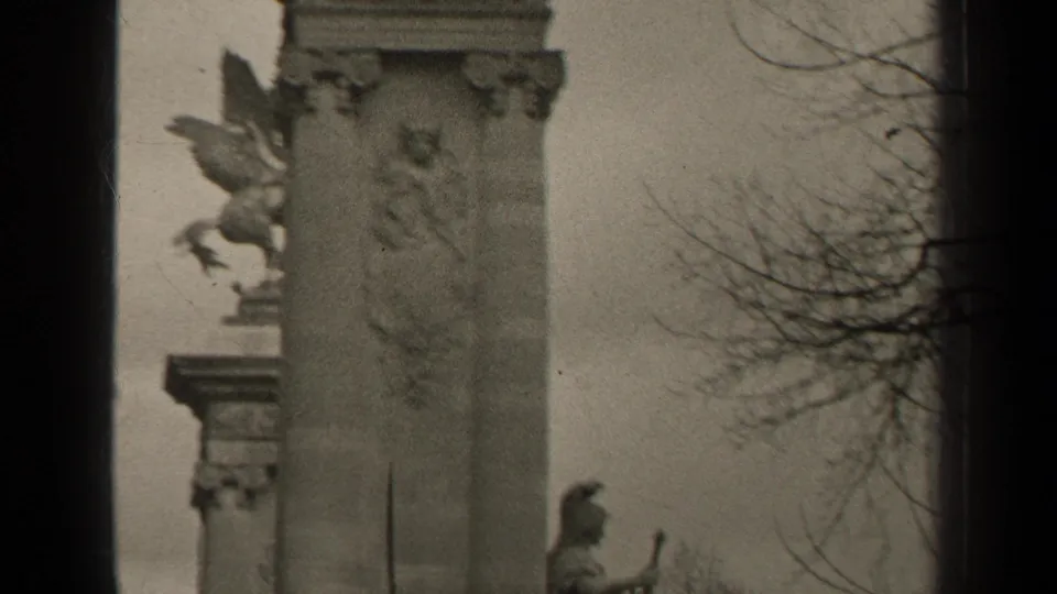 1947 Paris 8mm view of the lower monument structure, including carved stonework and a seated classical figure.