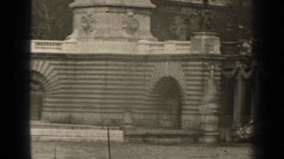Paris 1947 8mm frame showing a classical stone facade with relief decoration, balustrades, stairs, and arched openings.