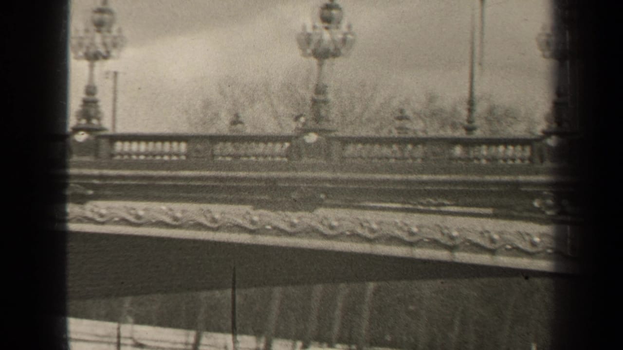 Ornate bridge balustrade with lampposts and carved stone detail.