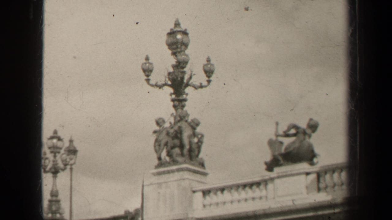 Ornate bridge lamps and sculptural figures above a balustrade.