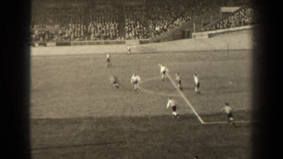 A 1947 Paris soccer match view shows players near the penalty area, with a large seated crowd in the background.