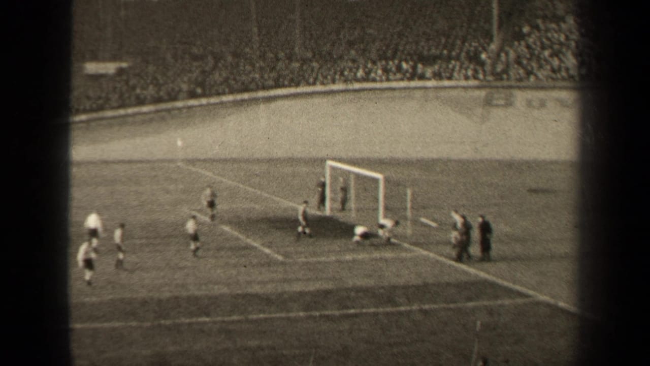 A goalmouth moment during the 1947 Paris football match, with players in light and dark kits moving around the box.