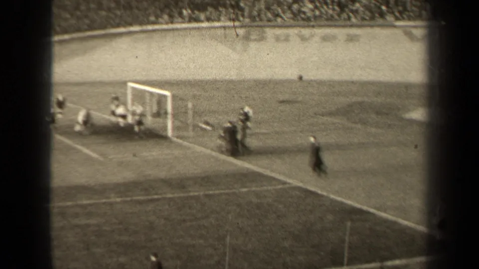 The 1947 Paris football clip shows a close goalmouth scramble, with players near the ground and spectators in the background.