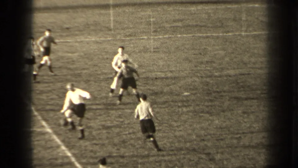 1947 Paris soccer footage shows adult male players in contrasting uniforms moving around the ball near field markings.