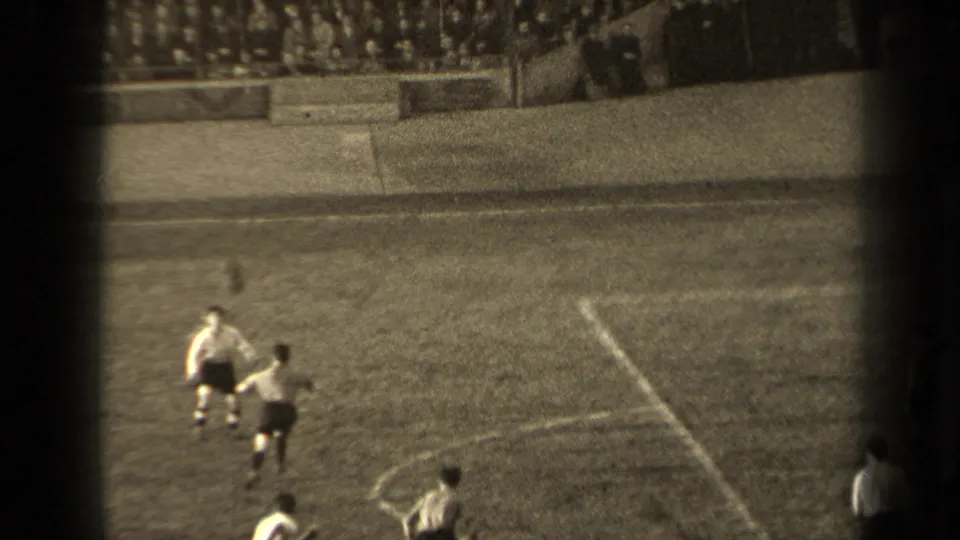 1947 Paris soccer frame showing players spread across the pitch during active play near the marked center area.