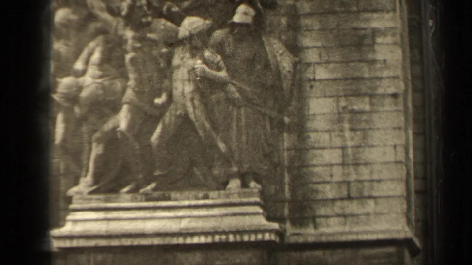 Close 1947 Paris view of Arc de Triomphe relief sculpture, with carved figures and adjacent masonry visible in soft 8mm texture.
