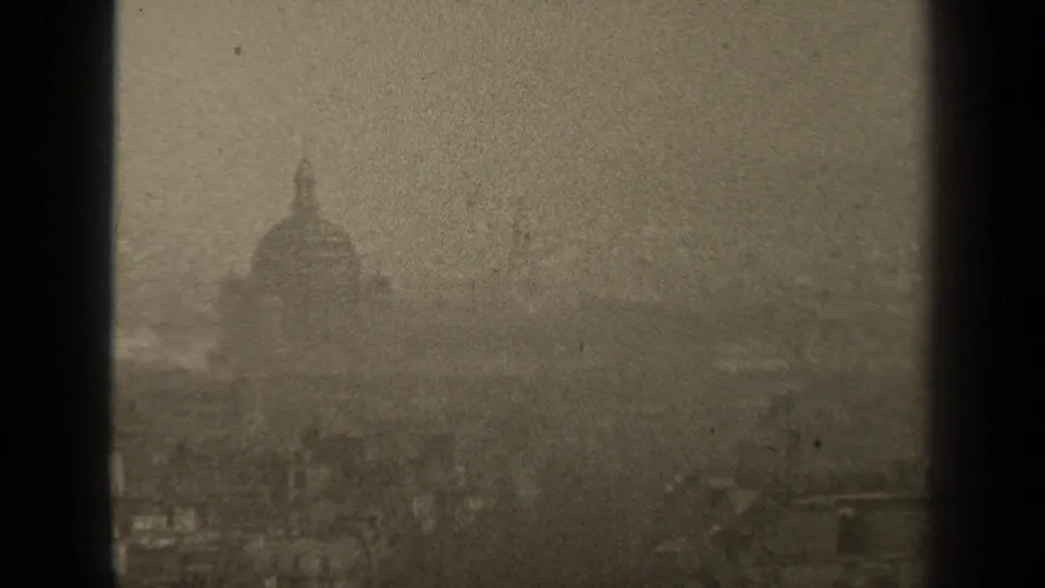 Hazy 1947 Paris skyline with a domed structure centered between dark vertical window bars.