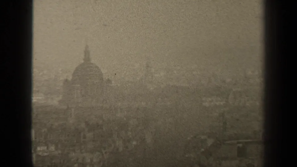 1947 Paris archival frame with a dim domed skyline, window bars, and dense film grain.