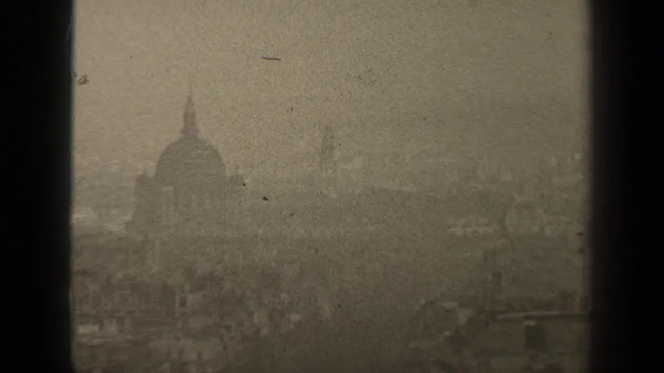 1947 Paris skyline seen through haze, with a domed landmark and dark window framing.