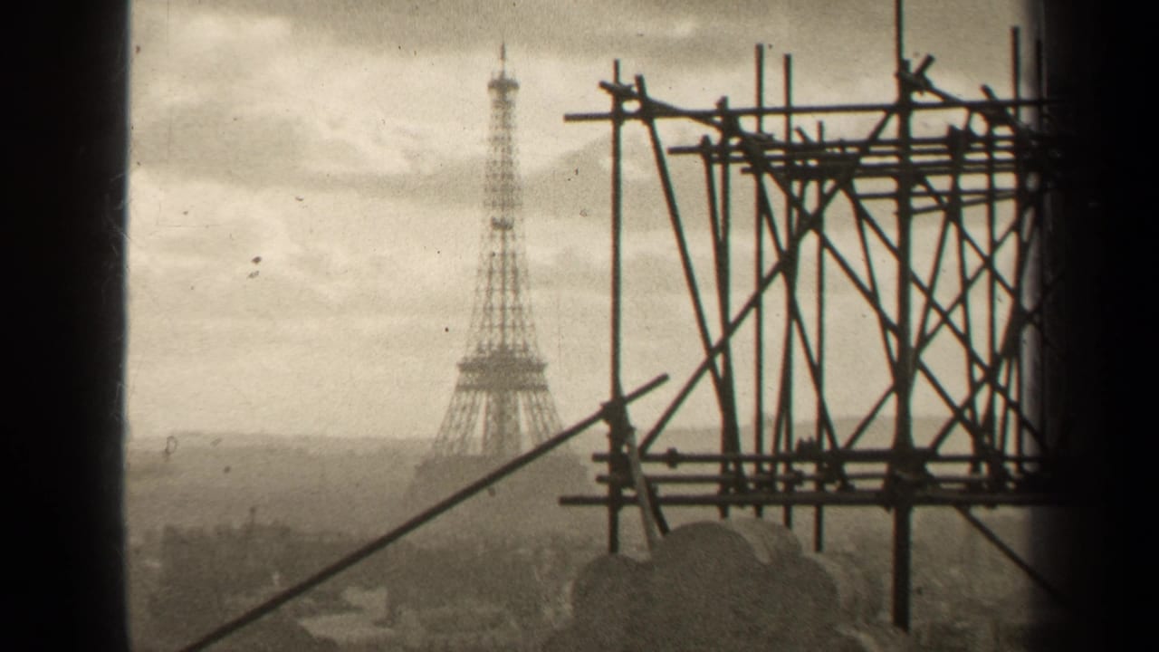 Eiffel Tower in the distance with scaffold poles filling the right side of the frame.