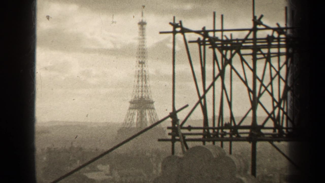 Paris 1947 home-movie frame with the Eiffel Tower in the distance behind foreground scaffolding and soft film grain.