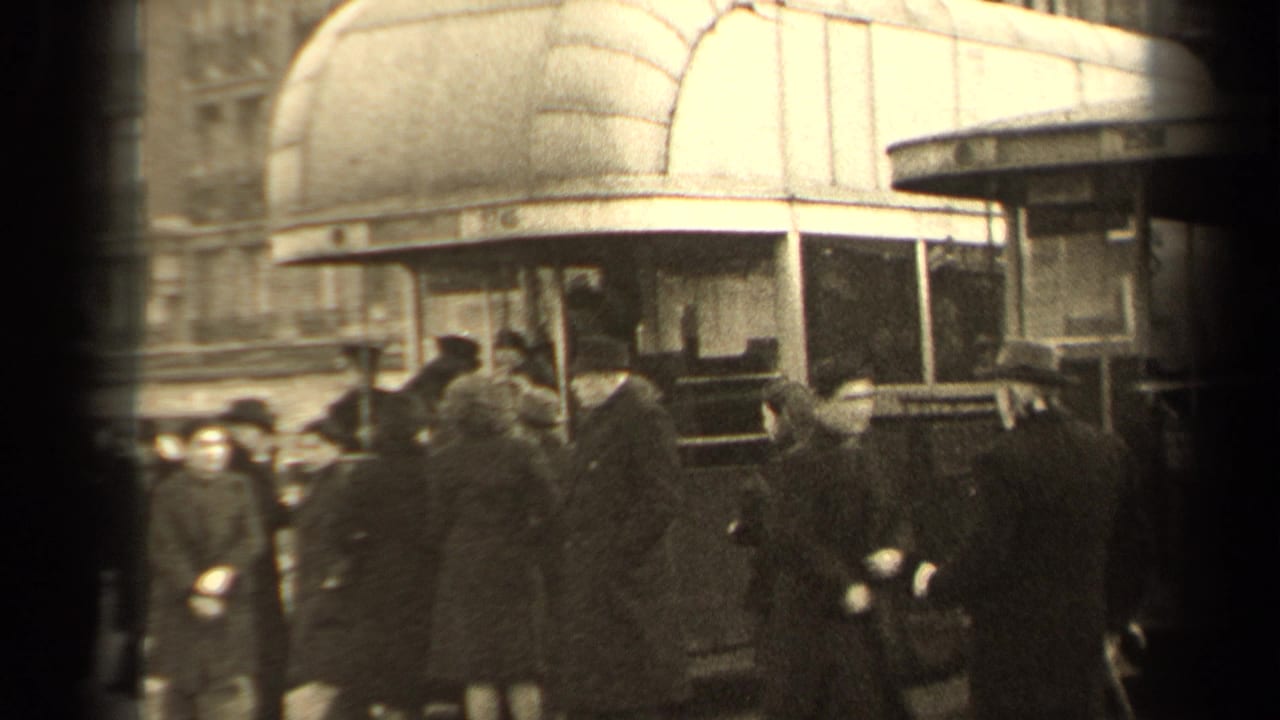 Crowd of pedestrians beside a double-decker bus on a city street.