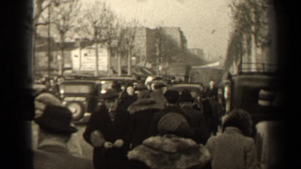 The closing frame shows 1947 Paris pedestrians in period coats and hats moving through a crowded street with older cars nearby.