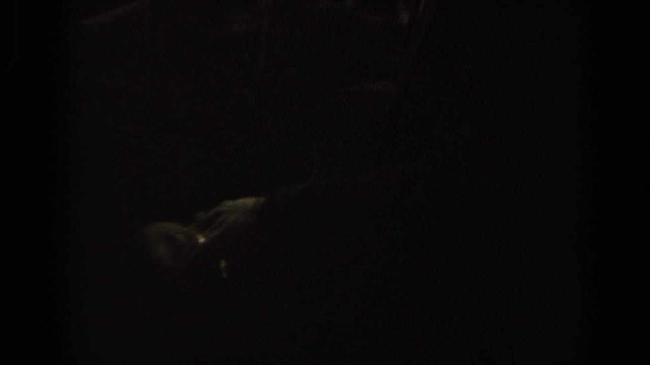The final frame is underexposed, showing dark silhouettes of shoppers with only limited detail visible in the market crowd.