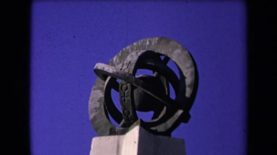 1967 Los Angeles 8mm still showing the same geometric metal sculpture, slightly lower in the frame.