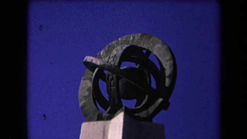 Final 1967 Los Angeles frame with the abstract ring sculpture held steady against a saturated sky.