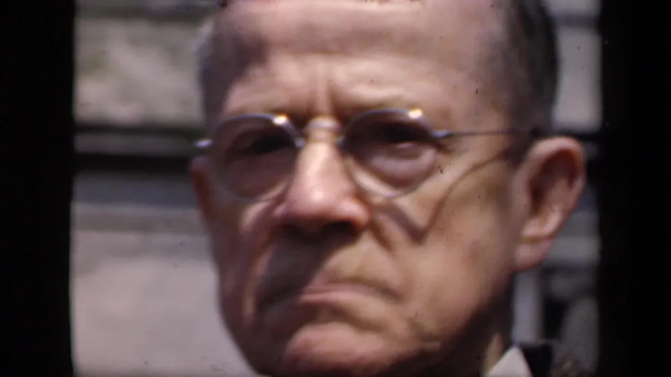 1941 New York 8mm close-up of an older man wearing glasses, with softened focus and dark film borders around the outdoor portrait.