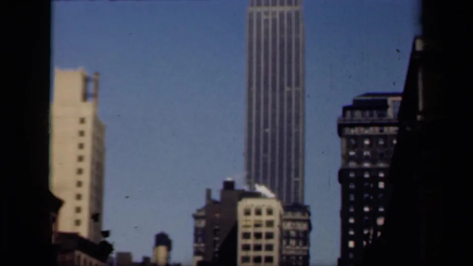 New York skyscraper view from 1941, with the tower centered higher in frame above darker neighboring buildings.
