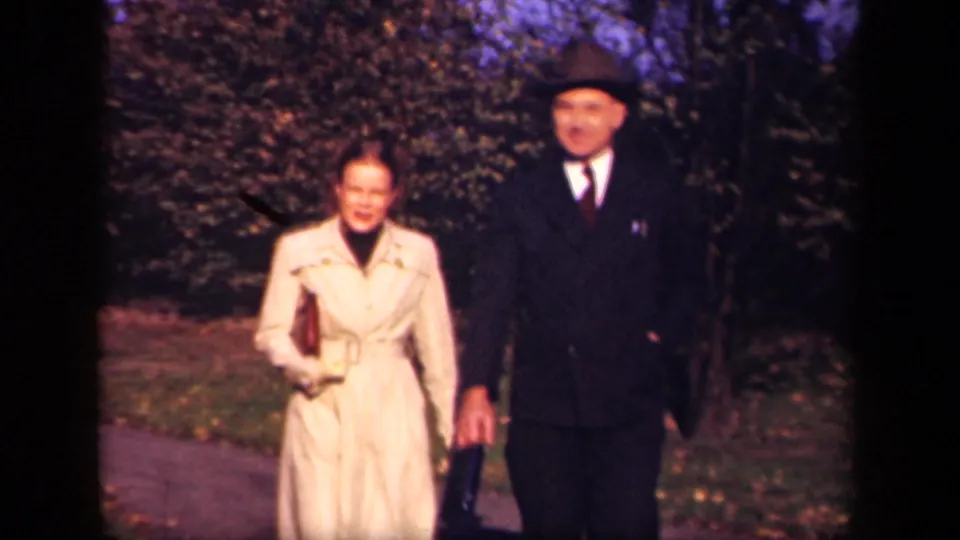 Near the end of the 1941 New York park clip, the couple approaches in soft 8mm color with faces visible.
