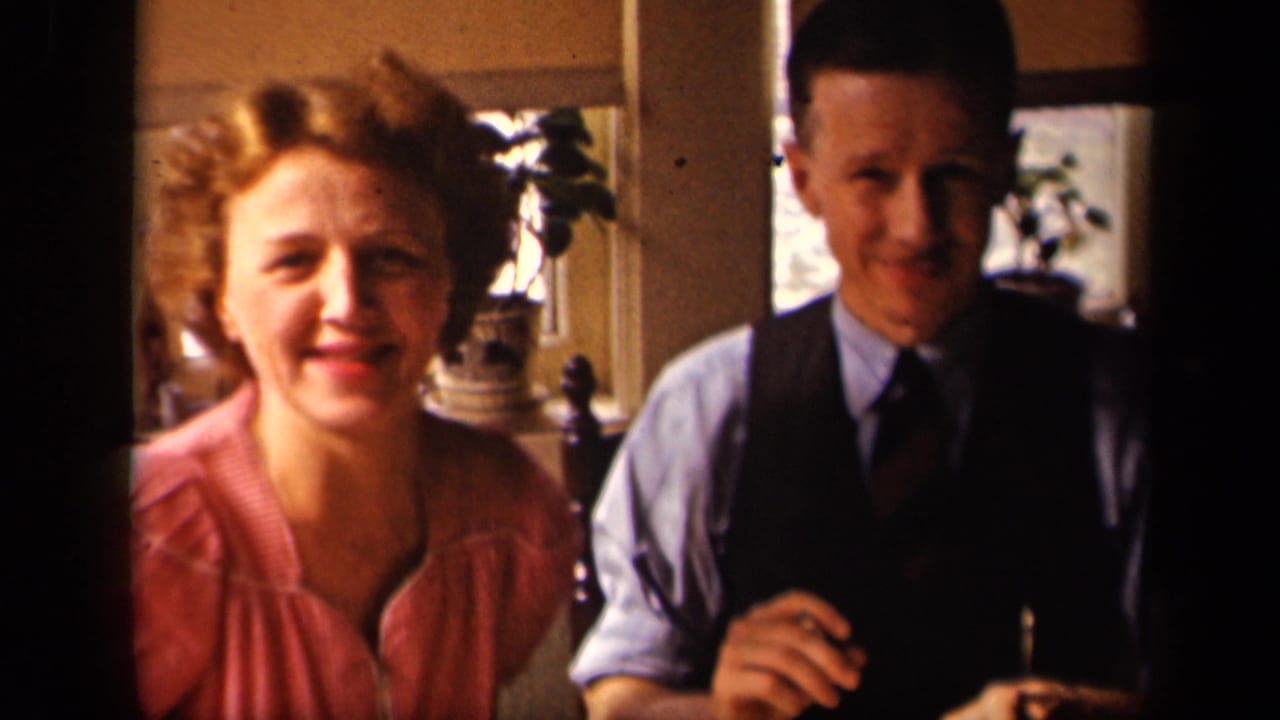 The couple faces the camera in a sunlit Sebring, Ohio kitchen, with the woman smiling and the man seated beside her.