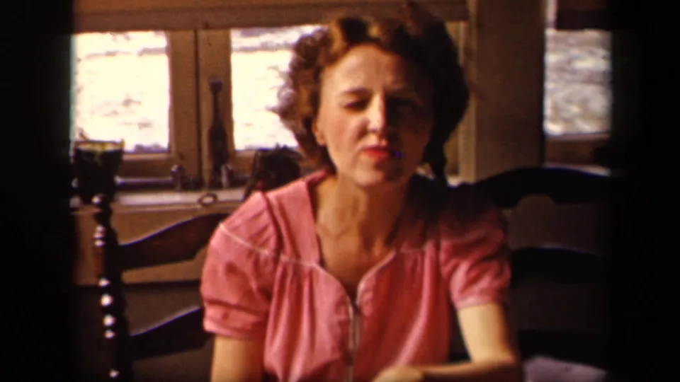 The final frame shows the woman seated alone in the warm 1942 Sebring, Ohio interior, with chairs and bright windows behind her.