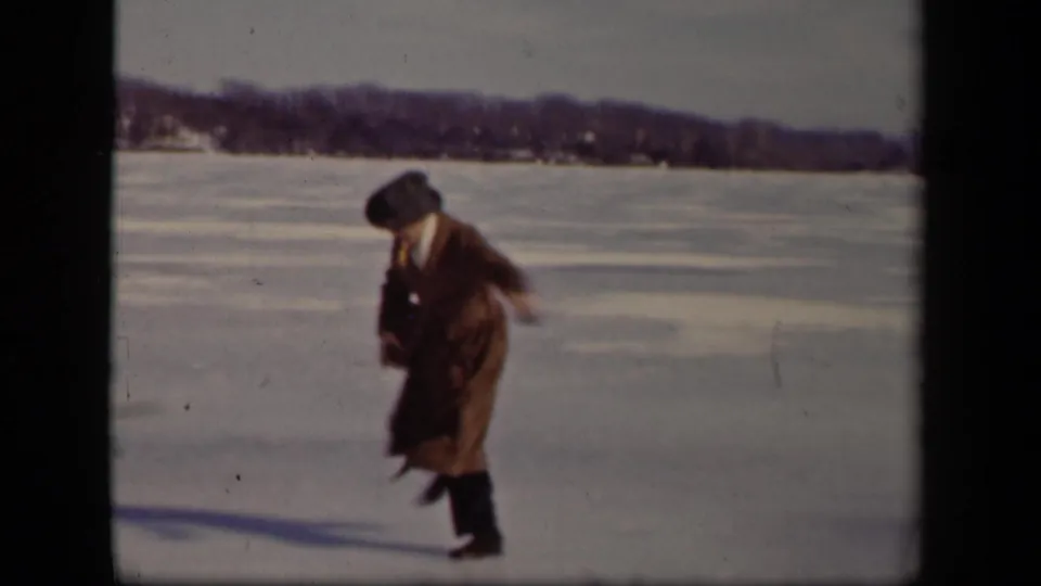 Near the end of the Sebring, Ohio clip, the man looks down and steps carefully across the icy lake surface.