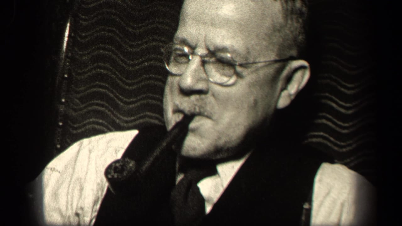 Sebring, Ohio 1942 frame of an older man with wire-rim glasses and a pipe, filmed close up in a dim interior.