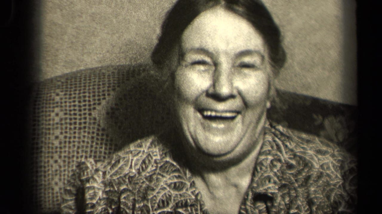 The woman faces the camera with a broad smile in this 1942 Sebring, Ohio home-movie close-up.