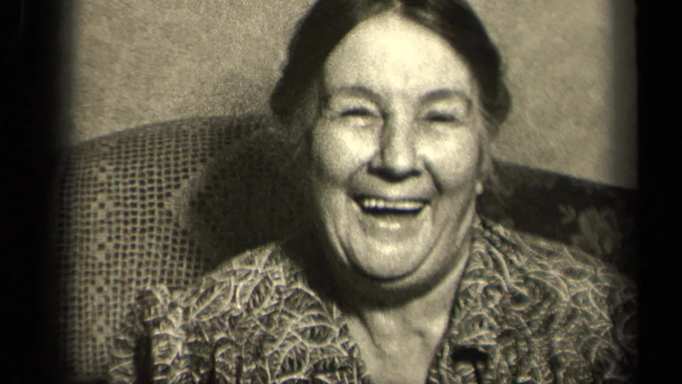 The woman faces the camera with a broad smile in this 1942 Sebring, Ohio home-movie close-up.