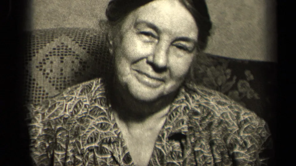 The final frame shows the older woman smiling gently in the same 1942 Sebring, Ohio domestic home-movie setting.