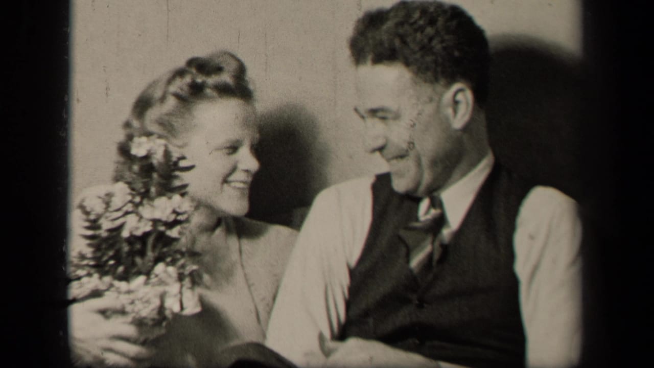In 1942 Sebring, Ohio home-movie footage, a young woman with flowers smiles toward a young man in a vest and tie.