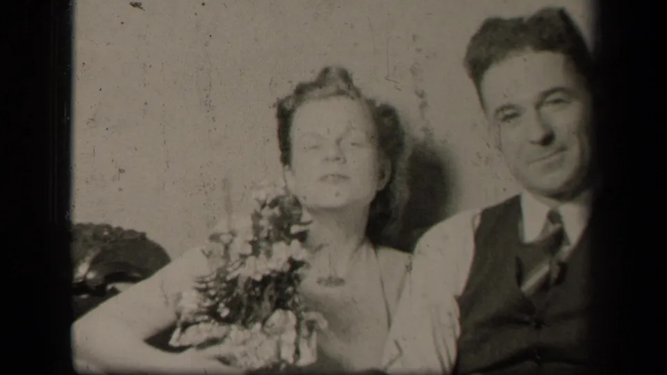 The final frame shows the same 1942 Ohio couple seated together on a sofa, with flowers, formal clothing, and visible film wear.