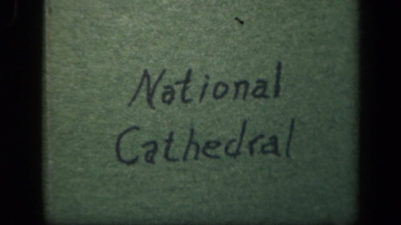 Handwritten National Cathedral title card on green paper in 1943 8mm home-movie footage.