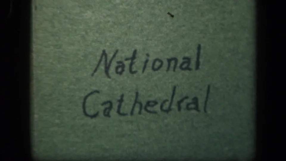 Handwritten National Cathedral title card on green paper in 1943 8mm home-movie footage.